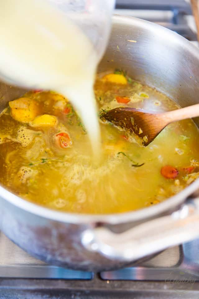 Pour the vegetable broth into the pot