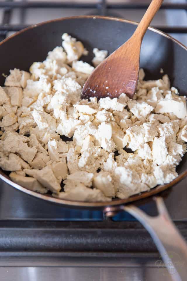 Crumble the tofu with your fingers, directly over the pan and cook until heated through and slightly golden