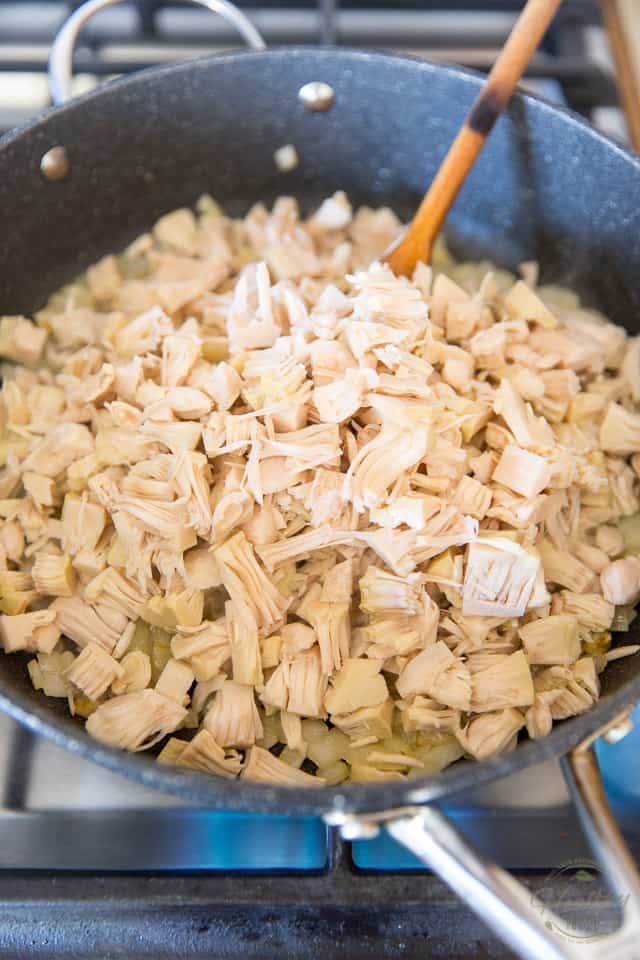 Adding the shredded jackfruit to the pan