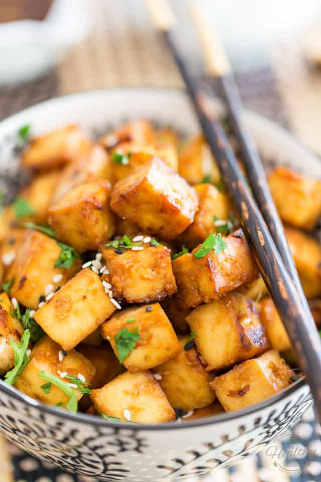 This Easy Oven Baked Tofu is so crazy yummy, tasty and addictive, you'll soon find yourself popping it like potato chips!