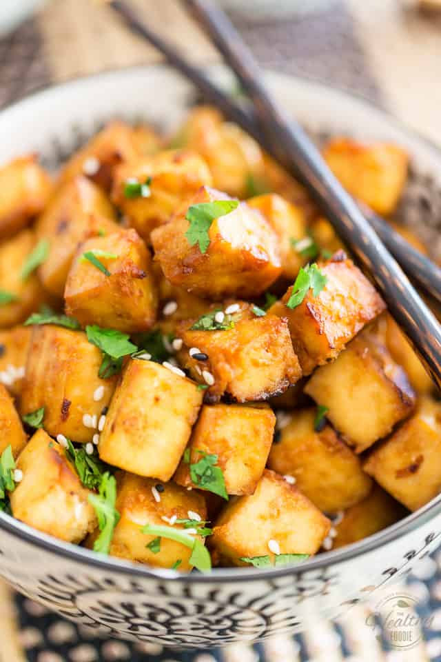 This Easy Oven Baked Tofu is so crazy yummy, tasty and addictive, you'll soon find yourself popping it like potato chips!